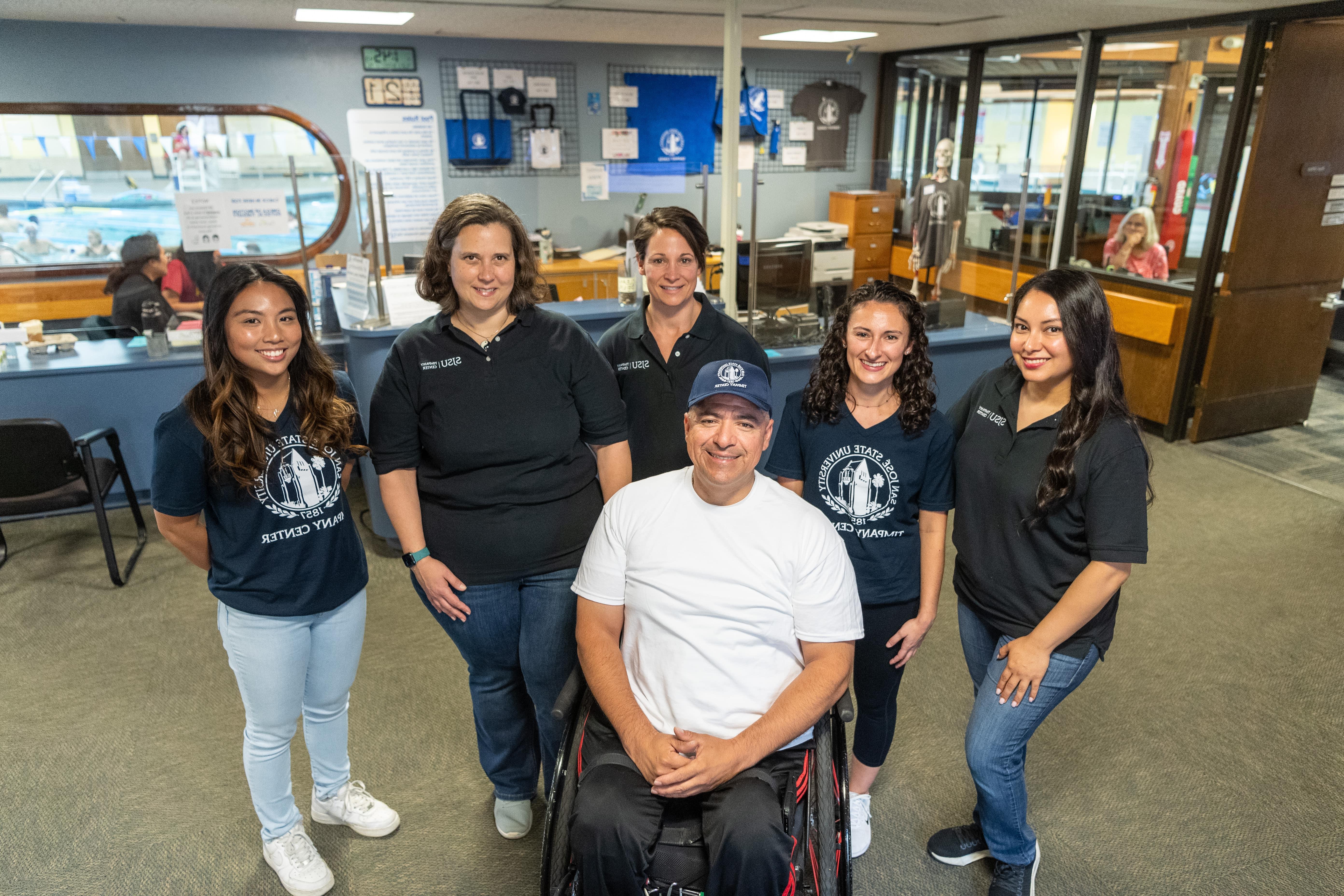 Timpany Center staff and clients have weathered many storms together. From left: staff members Carina Rodriguez-Tsai and Maranda Amaral, client Felipe Gonzalez, staffer Brittany Manrubia, program and operations director Jennifer Schachner, and staffer Kelsey Basilio. Photo: Robert C. Bain.